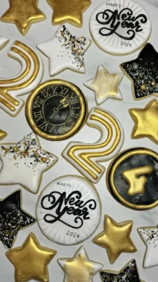 New Years Cookies for 2024 with the number "2024", stars, and "Happy New Year 2024" in white, black, and gold.