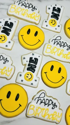 Smiley face first birthday cookies