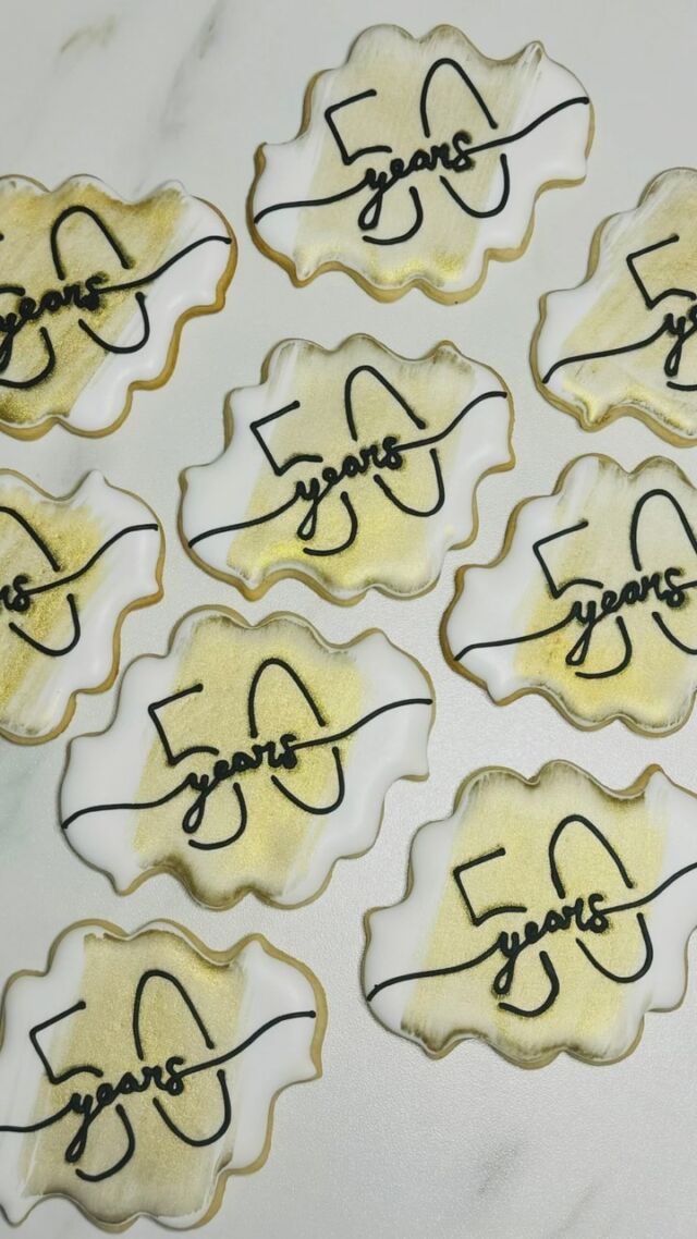 Adding a touch of golden elegance ✨🏅 

Celebrating 50 years of love with these special anniversary cookies. Watch as I hand-paint metallic gold accents to make every detail shine as bright as the couple’s journey together. ❤️🍪 

#50thAnniversary #GoldenLove #CookieArt #SweetCelebrations #HandcraftedElegance